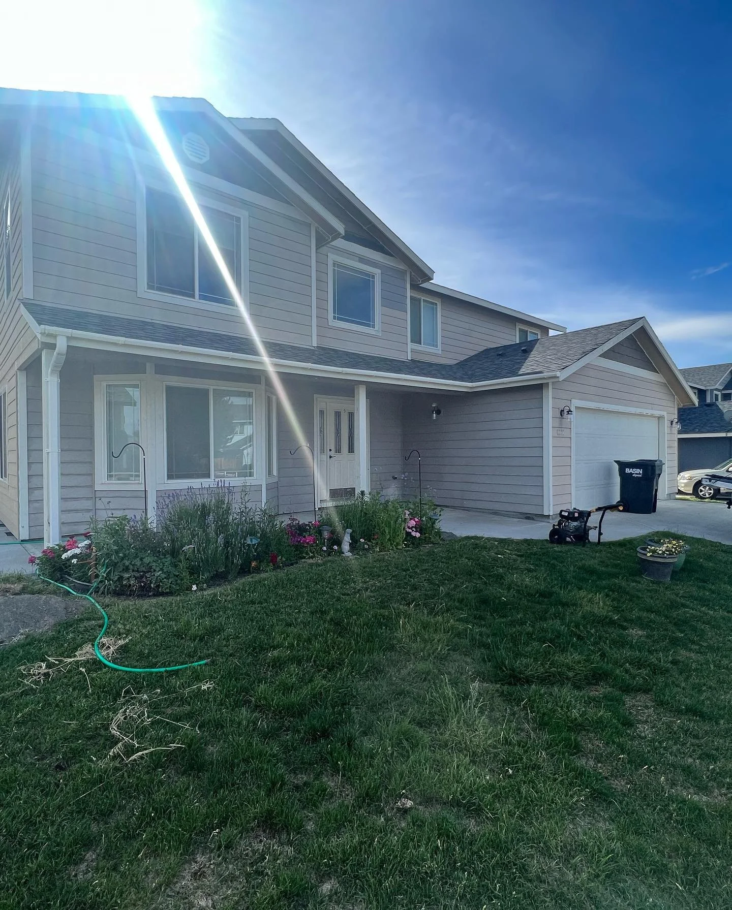 Two-story home exterior before wash and paint