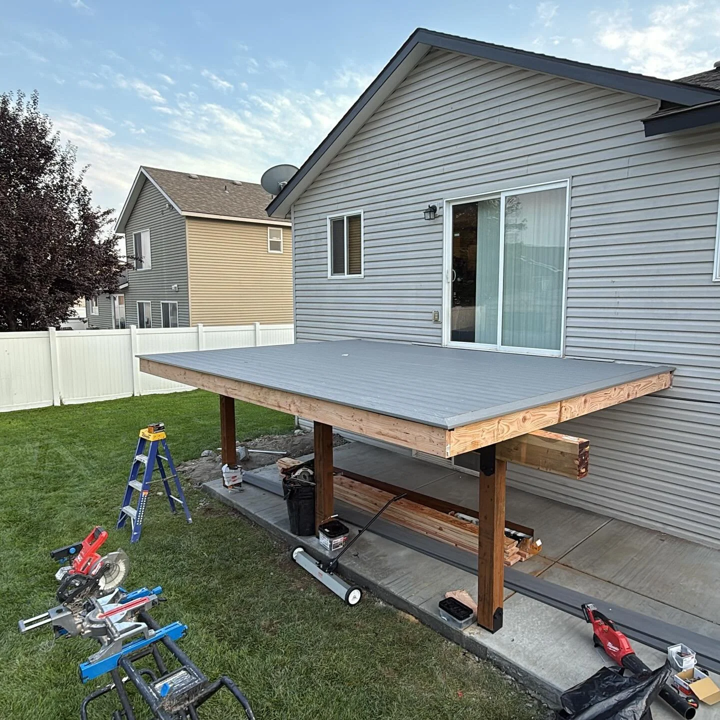 Deck surface with new boards and railing posts